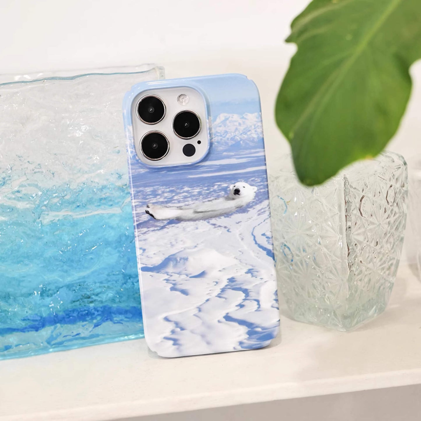 iphone case featuring a polar bear chill and lying on icy sea, cute iphone case, animal lover, front near view