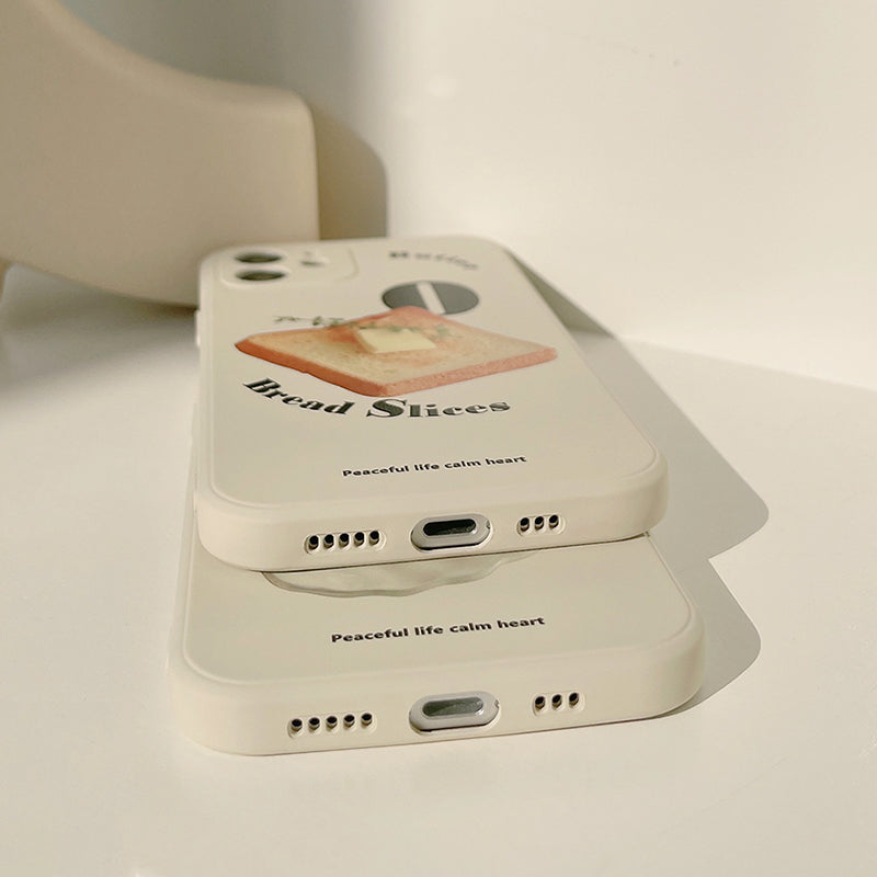 iPhone case. beige colour-based iPhone case with toast illustration. Soft TPU material. Bottom view.