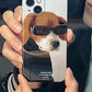 iPhone case. Original design iPhone cases with dog illustrations. Half-covered, super slim & lightweight phone case. Hard polycarbonate material. Man holding front view.