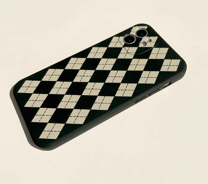 iPhone case with black colour based featuring white retro Checkerboard illustrations. Made from soft TPU polystyrene plastic material. Back angle view