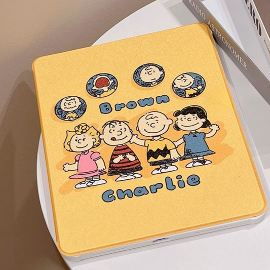 "Snoopy Squad Adventure iPad case with playful character designs from the Peanuts gang, featuring a vibrant yellow cover with protective features."