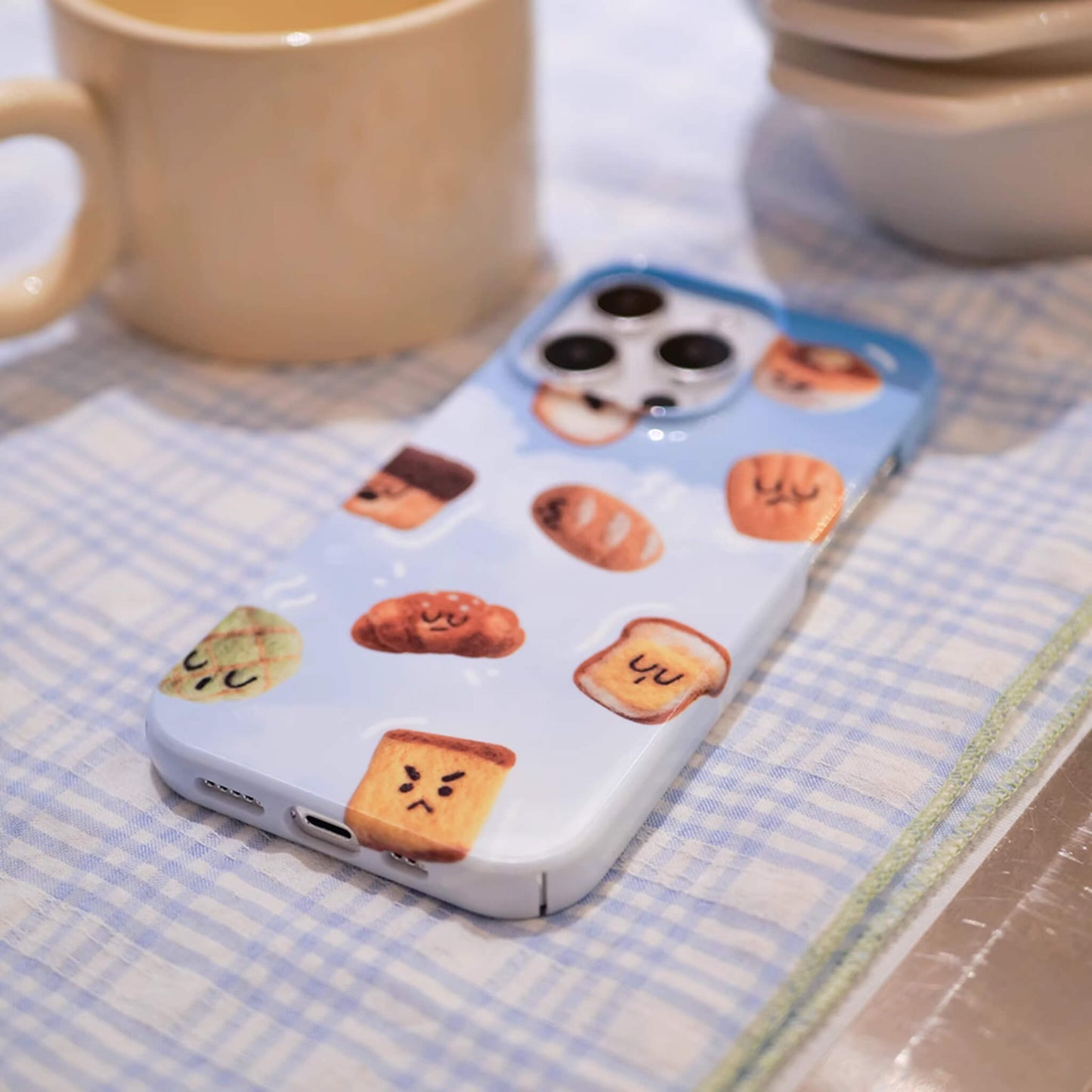 iphone 15 phone case, iphone case featuring cute and adorable toast with cute face on the sky cloud background, bottom view