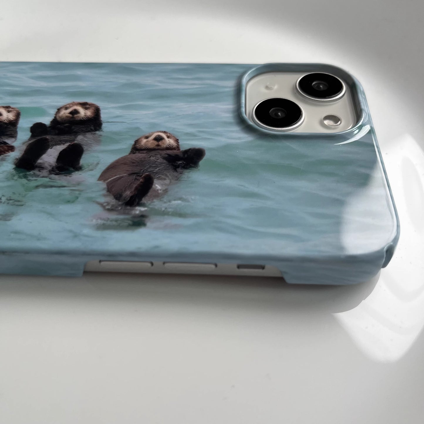 iphone cases, iphone case with cute otter design, animal lover, cute phone case, iphone 14 pro max, side view