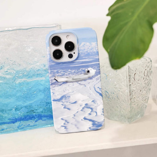 iphone case featuring a polar bear chill and lying on icy sea, cute iphone case, animal lover, front  near view