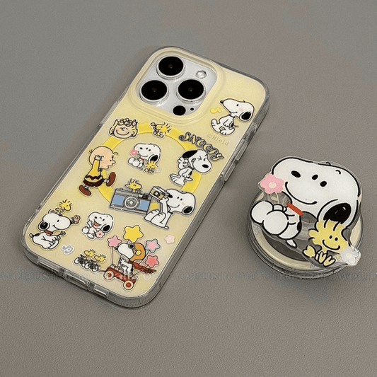 Snoopy Sunshine Moments MagSafe iPhone case with popsocket, featuring Snoopy and friends in joyful poses on a sunny yellow background.