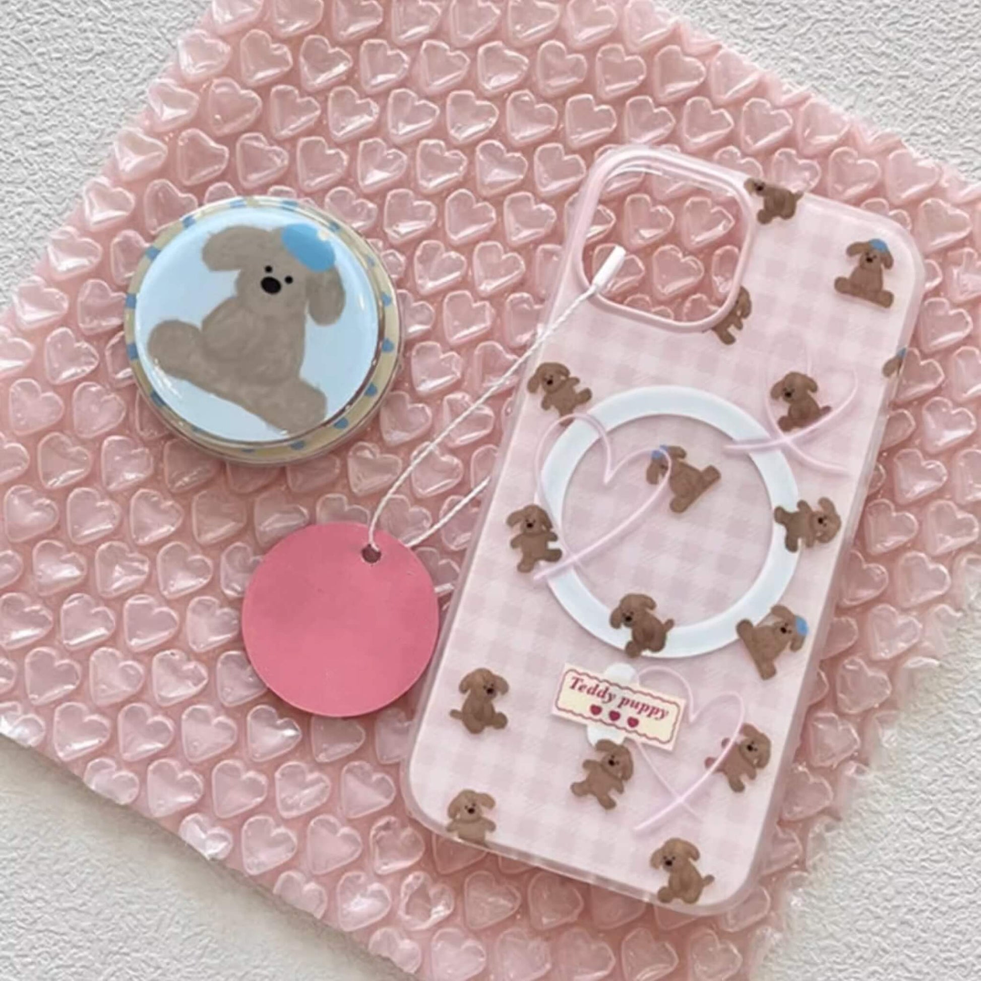 Pink MagSafe phone case with adorable teddy puppies, perfect for a cute and secure phone upgrade