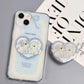 Charming MagSafe-compatible phone case displaying a heart with two cute puppies and 'sweet time' text, against a sky-blue background with soft clouds, next to a heart-shaped MagSafe popsocket with a matching design.